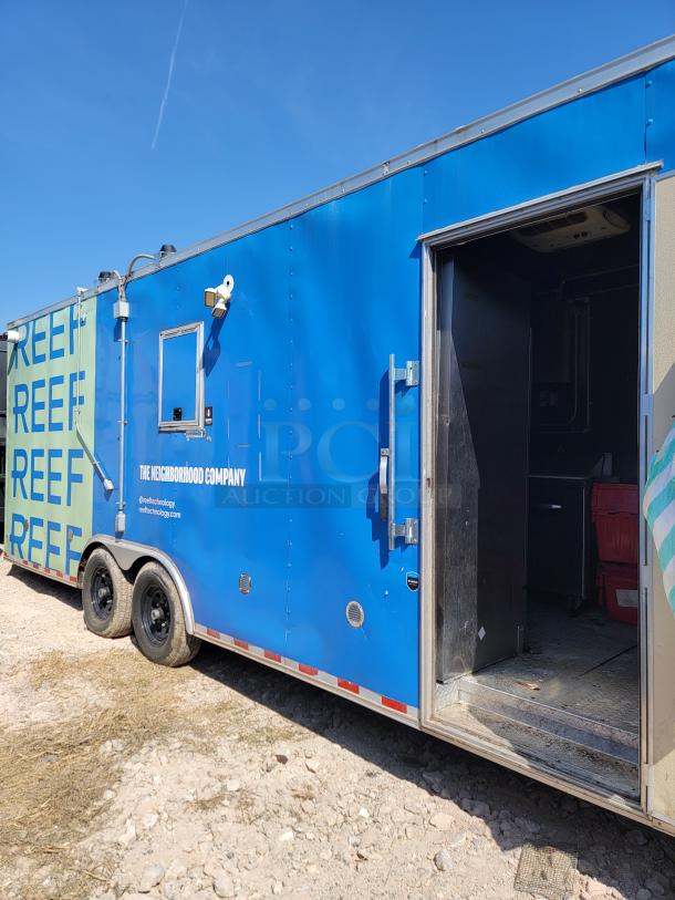 2021 Diamond Cargo 24’ mobile kitchen, dual-axle, blue exterior, labeled "The Neighborhood Company," equipped with industrial ventilation and fire suppression.