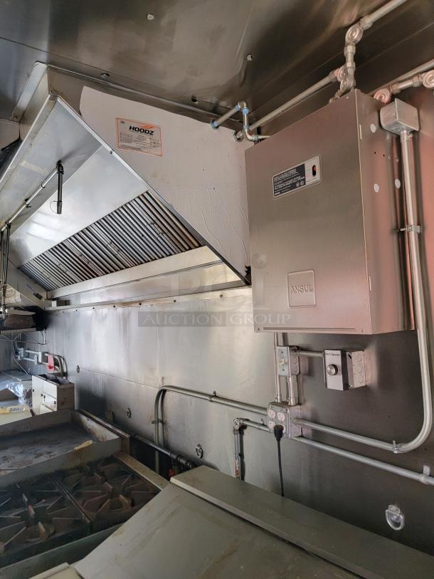 Interior of 2021 Diamond Cargo 24' mobile kitchen with CaptiveAire ventilation and Ansul fire system; shown in excellent condition.