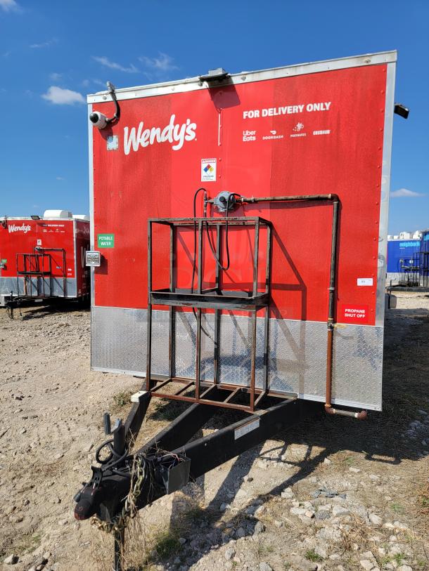 2021 Rock Solid Cargo 28’ Triple Axle Mobile Kitchen with Wendy's branding, signage for delivery, and propane shut-off label.