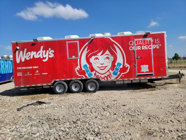 2021 Rock Solid Cargo 28' Triple Axle Mobile Kitchen, branded exterior, equipped for high-volume catering, excellent condition.