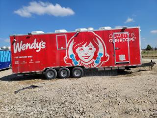 2021 Rock Solid Cargo 28' Triple Axle Mobile Kitchen, branded exterior, equipped for high-volume catering, excellent condition.