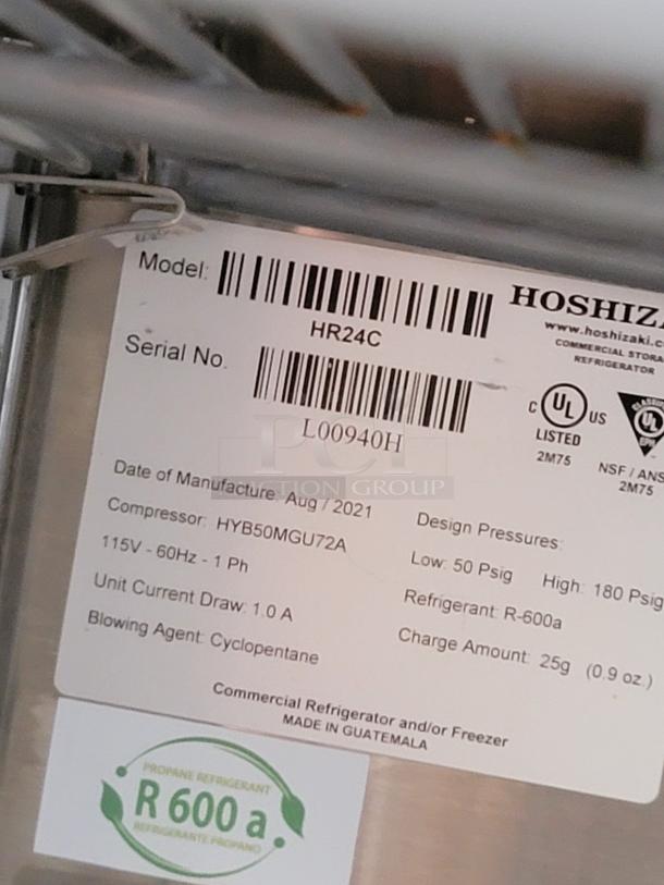 Label on Hoshizaki refrigerator model HR24C, serial L00940H, made August 2021. Includes voltage, refrigerant type, and pressures.