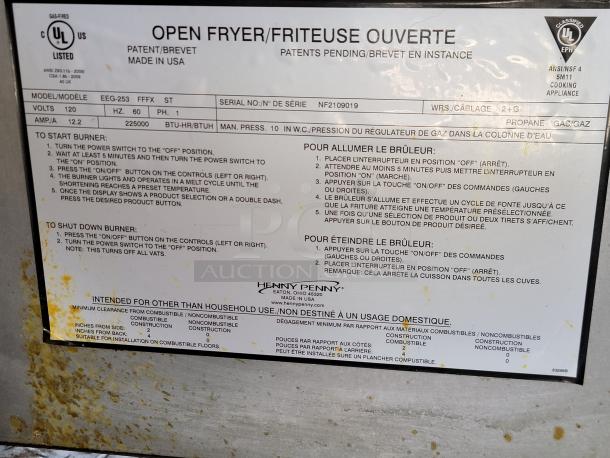 Tag on a fryer showing model EEG-253, UL listed, 225,000 BTU, propane use. Includes startup and shutdown instructions in English and French.