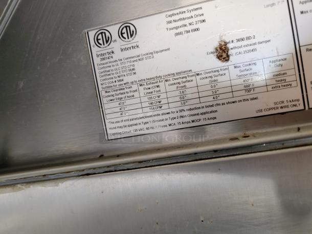 Label on CaptiveAire Systems ventilation hood details certification standards, clearance, and usage guidelines for commercial kitchens.