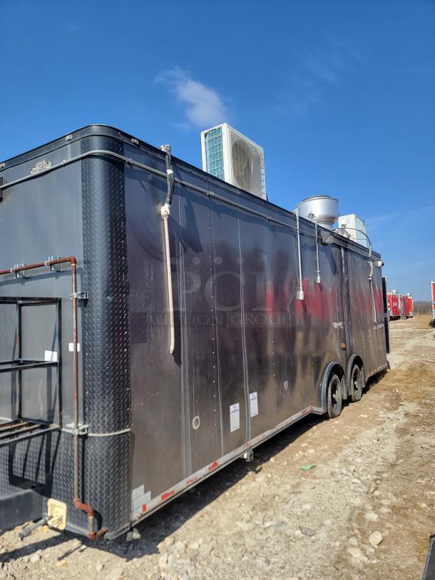 2020 Diamond Cargo 28' food trailer, black, dual axle, equipped with Black Diamond cooking gear, Arctic Air refrigeration.