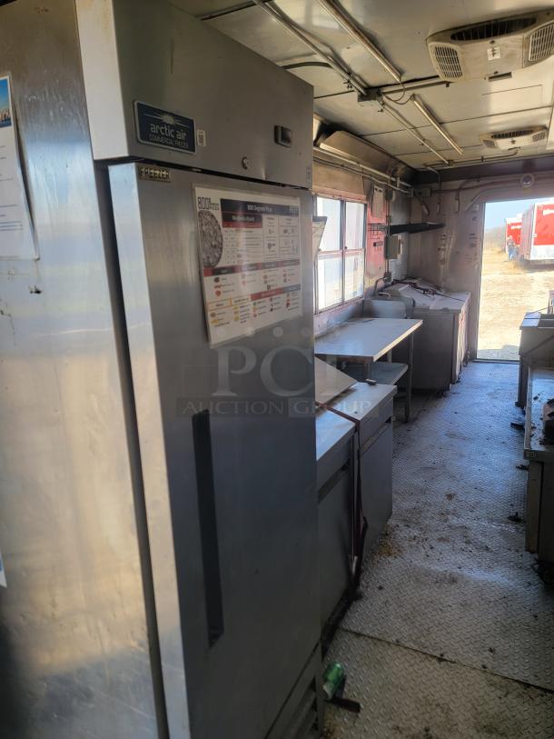 2020 Diamond Cargo 28' food trailer interior with Arctic Air freezer and Black Diamond cooking gear. Good condition.