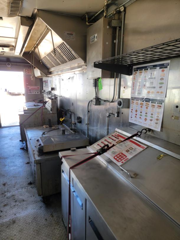 28' Diamond Cargo food trailer interior, featuring Black Diamond cooking gear and Arctic Air refrigeration. Well-equipped for high-volume service.