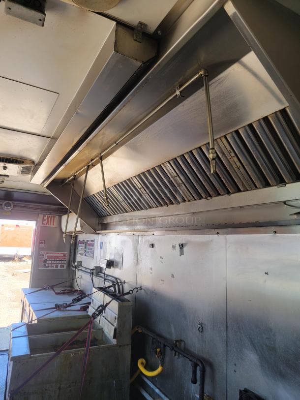 2020 Diamond Cargo 28' food trailer interior with Black Diamond cooking gear, ventilation hoods, and Arctic Air refrigeration.