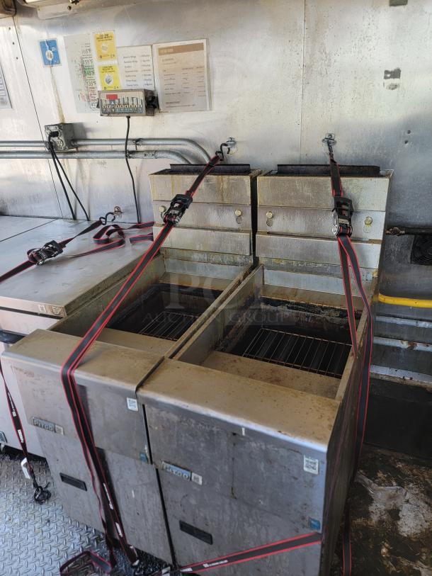 2020 Diamond Cargo 28' food trailer interior with Black Diamond fryers, secured with straps, for high-volume service.