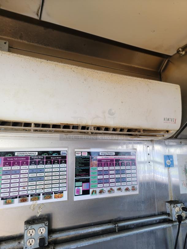 2020 Diamond Cargo 28' food trailer interior showing VentusX climate control unit, menu boards, and electrical outlets.