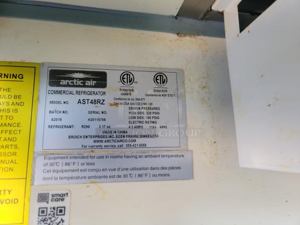 Arctic Air AST48RZ commercial refrigerator label, showing model, serial, batch numbers, design pressures, and warranty info.