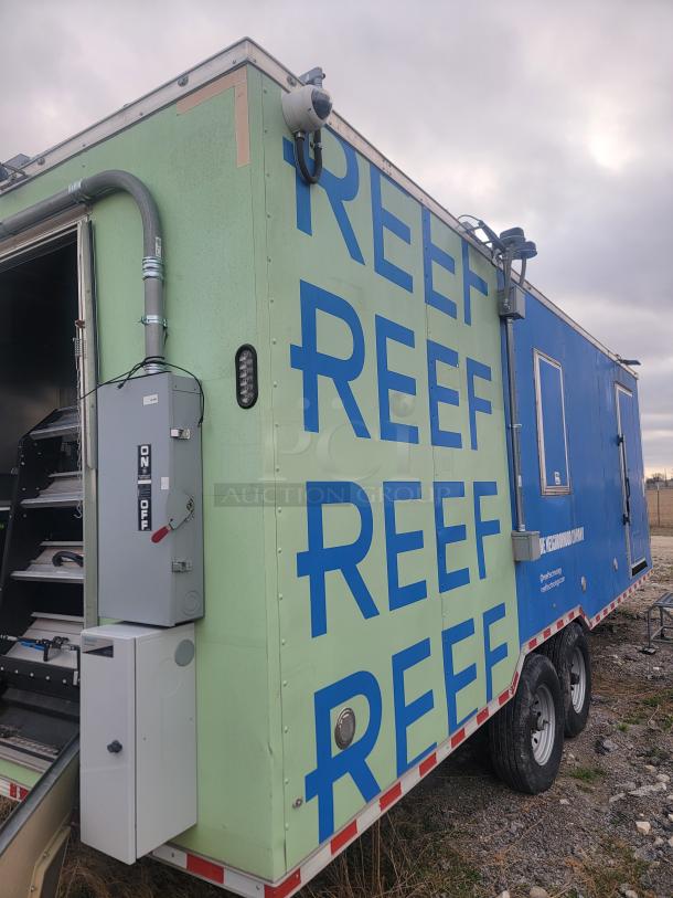 2021 Rock Solid Cargo 8.5' x 24' food trailer, dual axle, with external "REEF" branding, and visible electrical panel.