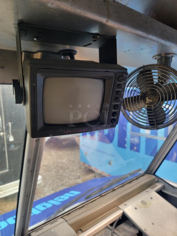 Vintage Safety Vision monitor mounted inside a vehicle, with control panel visible. Appears in used condition.