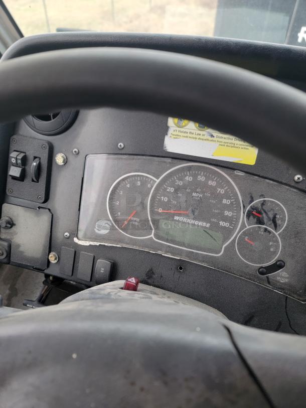 Vehicle dashboard featuring Workhorse brand speedometer and gauges. Light wear visible.