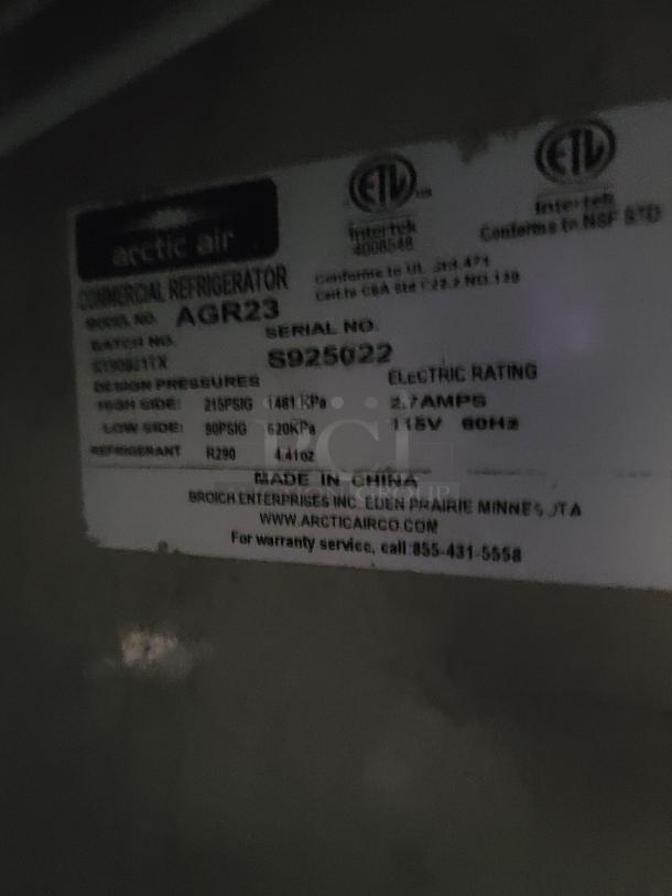 Arctic Air AGR23 commercial refrigerator label showing model AGR23, serial S925022, electrical rating 115V, 60Hz.