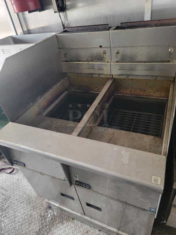 Pitco commercial deep fryer with dual fry pots, stainless steel body, used condition with some visible wear.