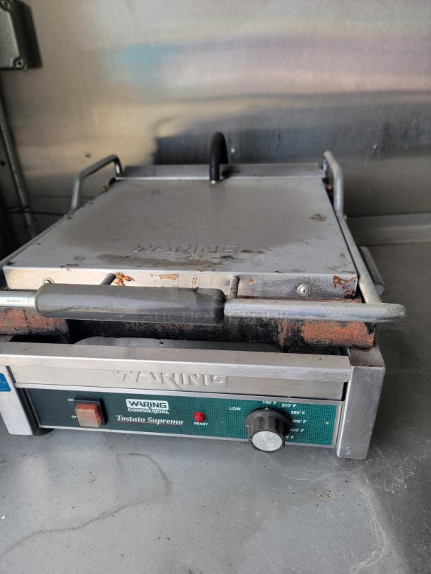 Waring Commercial Tostato Supremo toaster oven, stainless steel, showing signs of rust and wear. Marked controls, multiple settings.