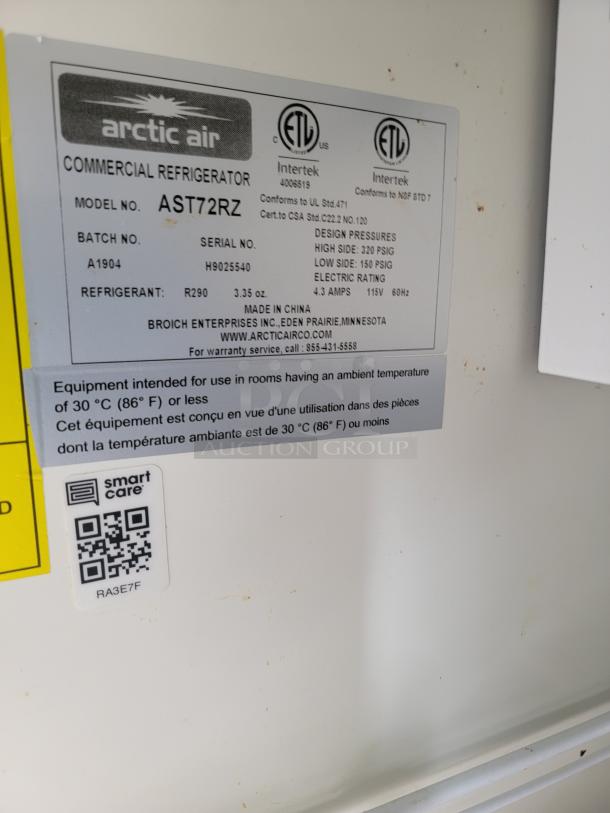 Arctic Air commercial refrigerator model AST72RZ label showing specifications, serial number H9025540, and design pressures.