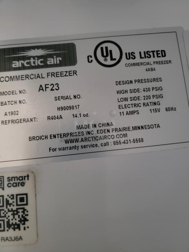 Arctic Air commercial freezer model AF23 label, serial H9009817, R404A refrigerant, UL listed, 115V, 11 amps.