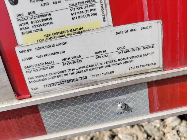 Label on a Rock Solid Cargo trailer. GVWR: 7031 kg, GAWR: 7031 kg, Tire size: ST235/80/R16. Manufactured 04/2021.
