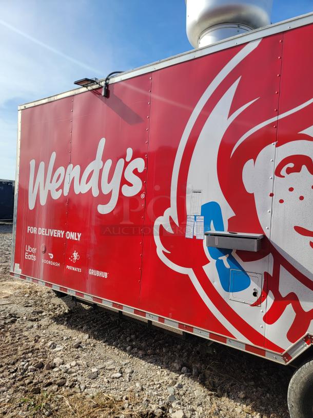 Red Wendy's delivery-only trailer with logos of Uber Eats, DoorDash, Postmates, and Grubhub. Ventilation unit on top.