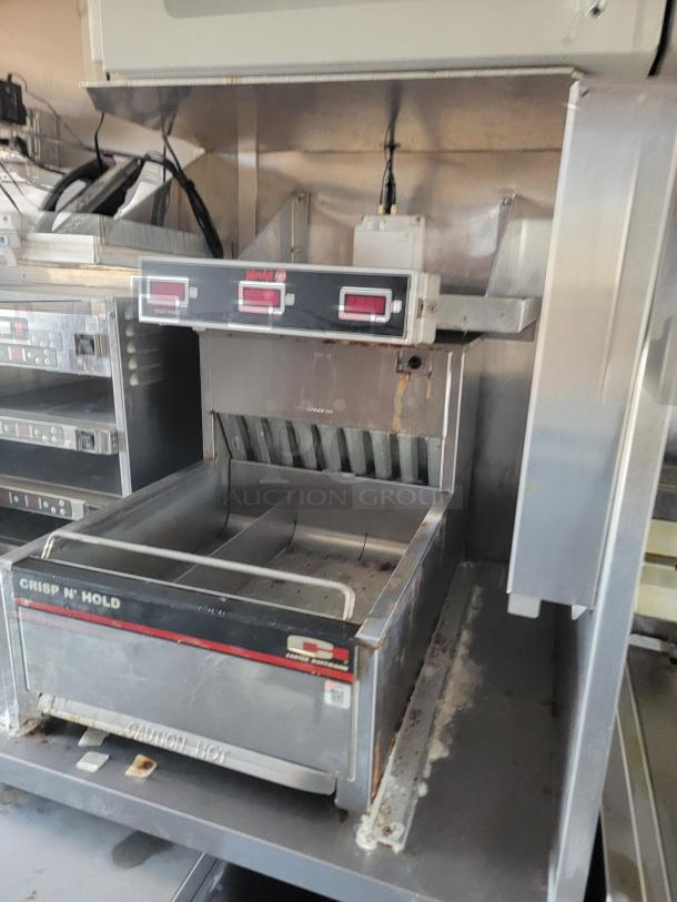 Carter-Hoffmann Crisp N' Hold food warmer, stainless steel, dual compartments, visible wear and rust, caution label marked.