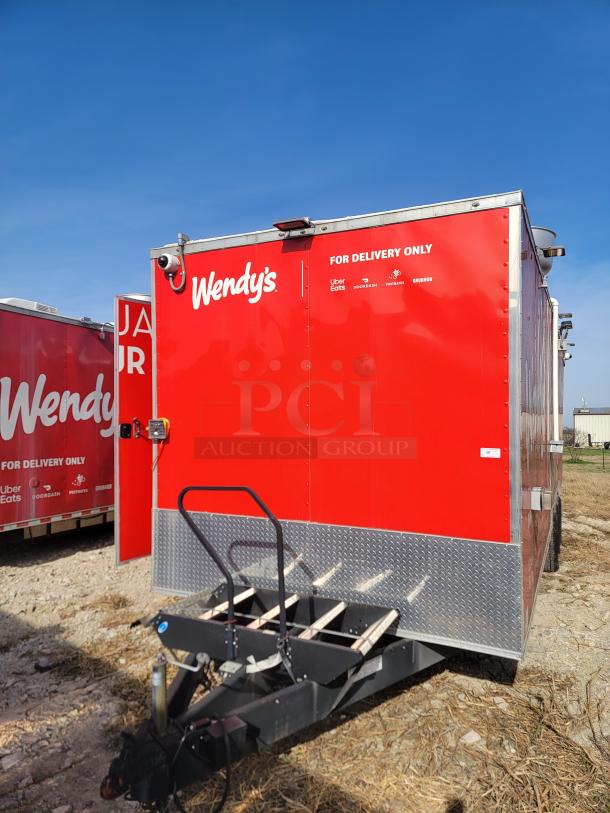 Red Wendy's delivery trailer with branding and delivery service logos. Clean exterior, diamond-plate base, with step access.