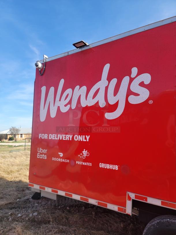 Red Wendy's food truck labeled "For Delivery Only" with Uber Eats, DoorDash, Postmates, and Grubhub logos.