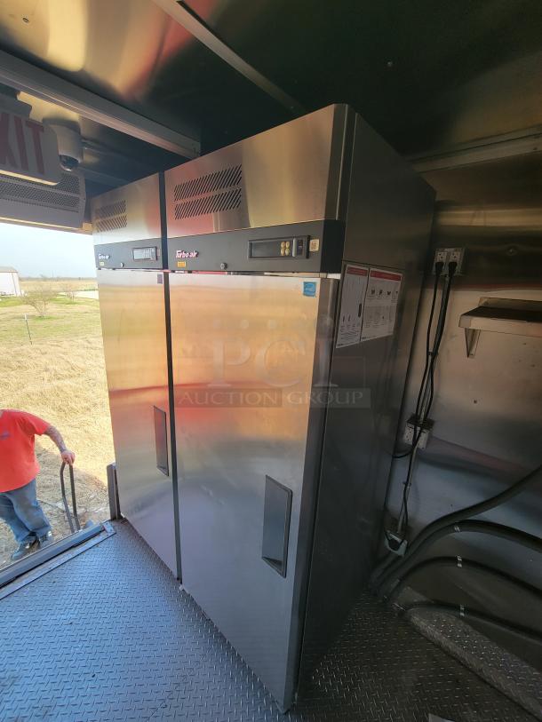 Stainless steel Turbo Air commercial refrigerator with dual doors, digital display, and side ventilation. Excellent condition.