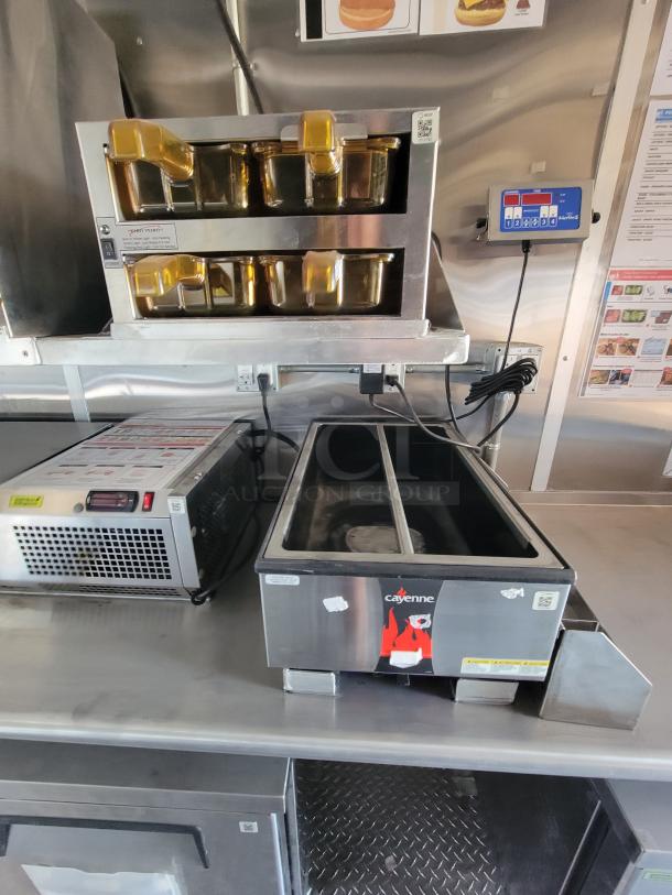 Industrial food warmer with two trays, stainless steel, by Cayenne. Includes controls and power unit, in good condition.