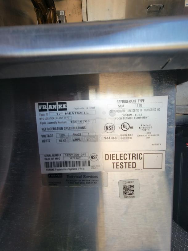 Franke Meatwell commercial refrigerator label showing model number 17, 120V, 1 phase, and serial number 3122100010145.