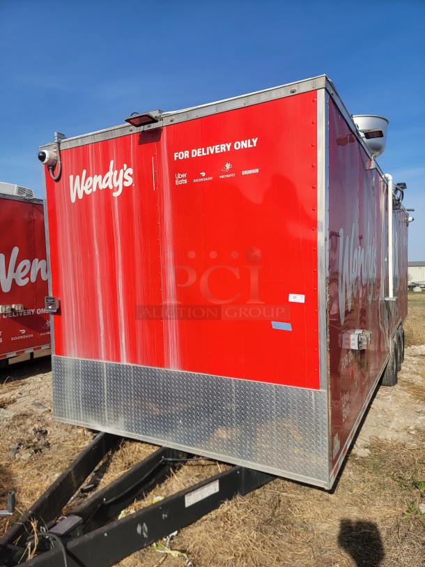 Red Wendy's delivery trailer with logos and "For Delivery Only" text, featuring Uber Eats, DoorDash, Postmates, and Grubhub.