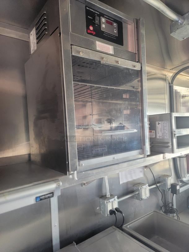 Wendy's warming cabinet, stainless steel, glass door, digital controls, excellent condition, ideal for commercial use.