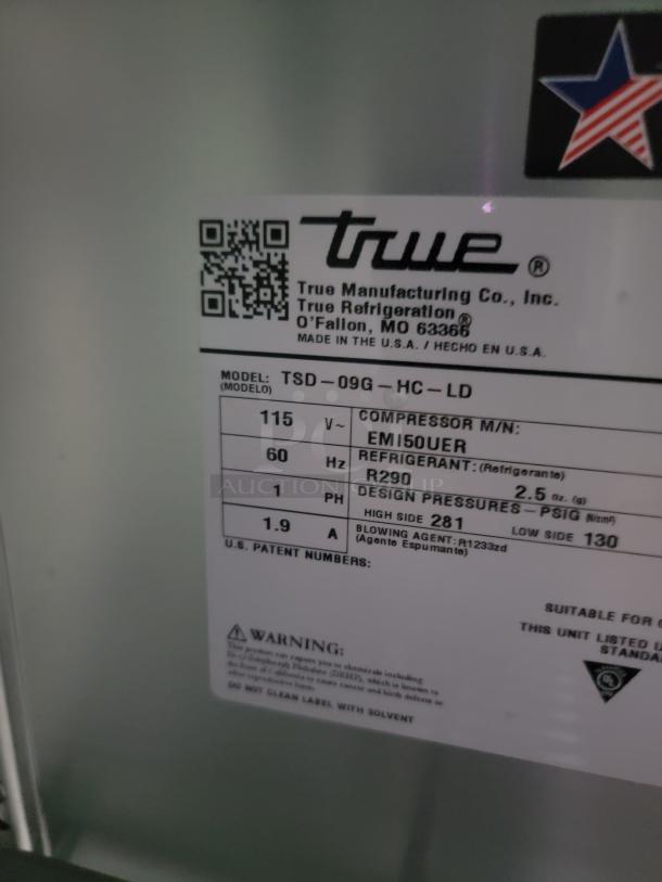Label on True Refrigeration unit, Model TSD-09G-HC-LD. Details power, refrigerant type R290, and design pressures.