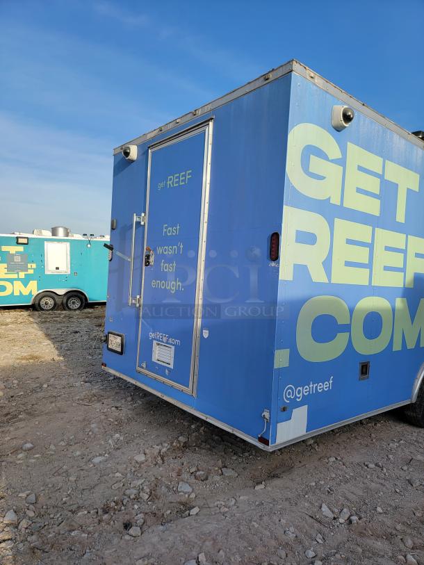 Blue mobile trailer with "get REEF" branding. Features include secure locks and camera. Appears in good condition.