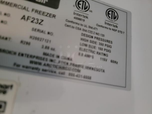 Label on commercial freezer model AF23Z, detailing design pressures, electric rating, and warranty info.
