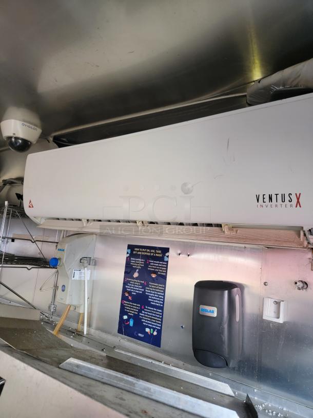 Ventus X inverter air conditioner, white, wall-mounted, visible Ventus branding, minor scuff marks, good condition.