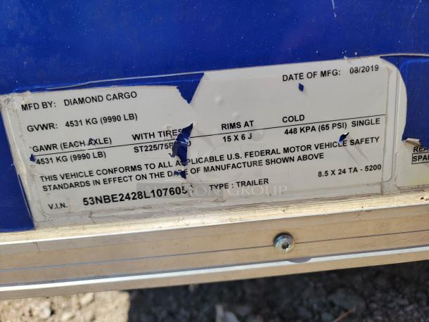 Diamond Cargo trailer label showing manufacturing date 08/2019, GVWR 4531 kg, VIN 53NBE2428L107605, and tire specs.