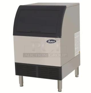 Atosa YR140 stainless steel ice maker, 88 lb storage, energy-efficient, scratch-n-dent, on legs, model tag visible.