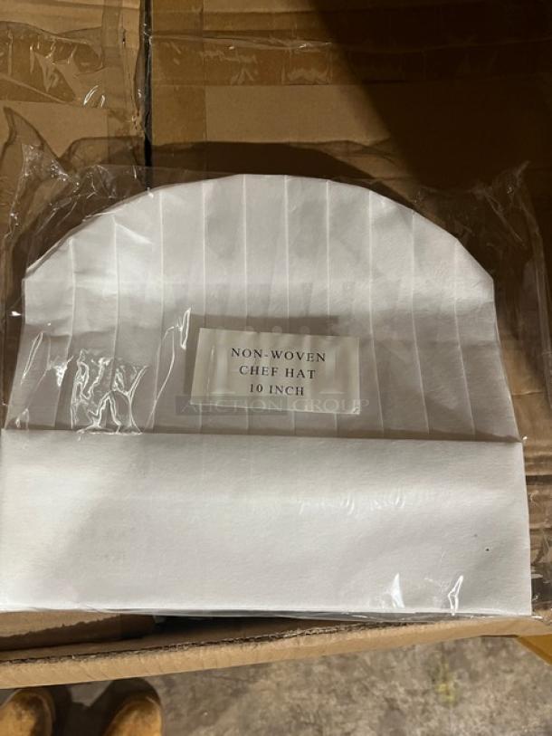 Brand new 10" non-woven chef hat in box, labeled "Non-Woven Chef Hat 10 Inch," pristine condition.