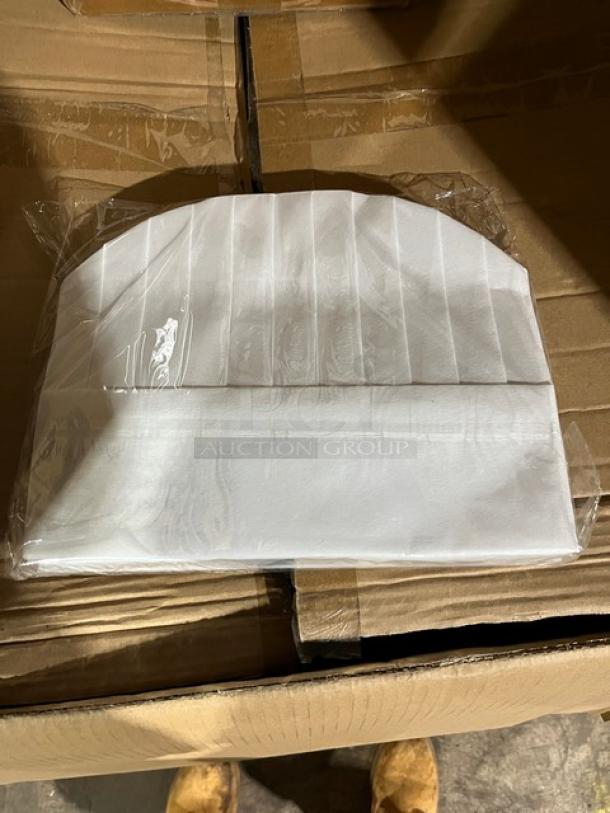 Brand new 9" non-woven chef hat in original packaging, pristine condition, features pleated design for professional look.