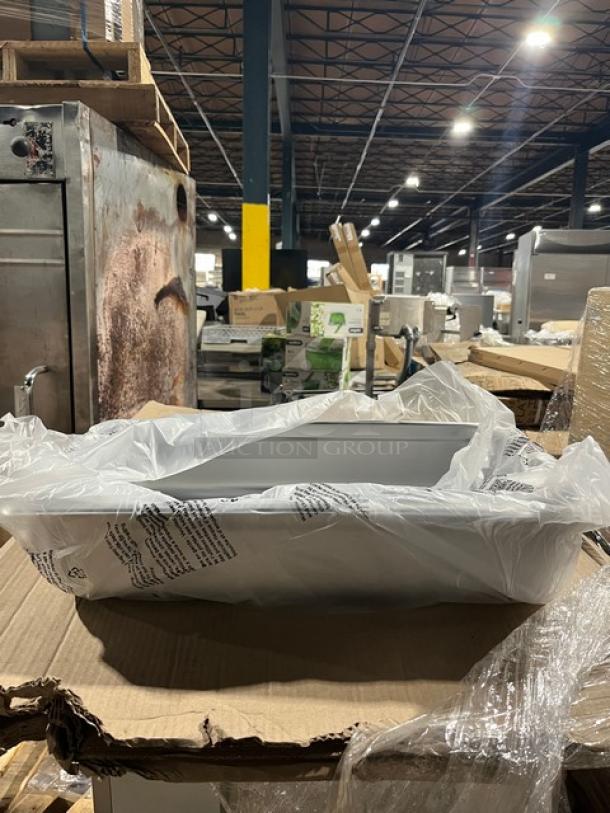 Brand new Crestware SAFTSTAK stainless steel 4" deep anti-jam hotel steamtable pan in packaging.