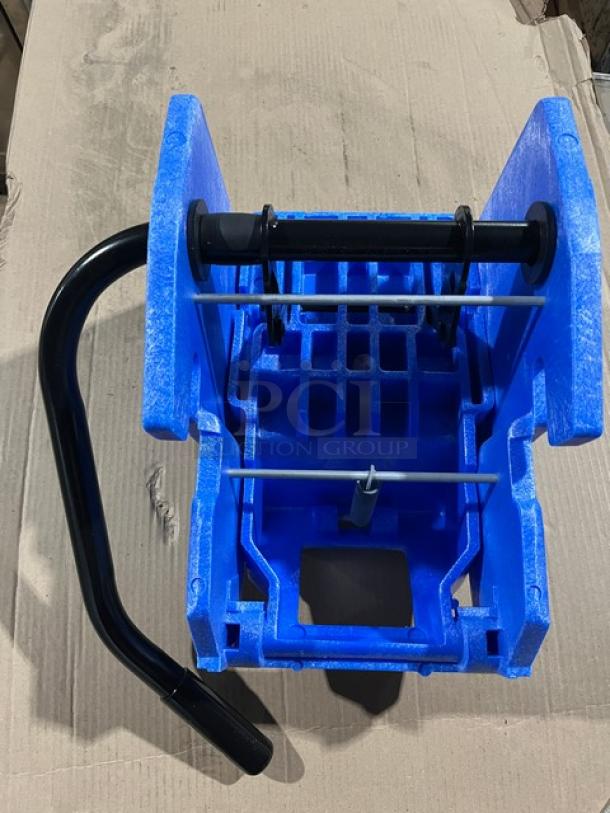 Brand new commercial blue plastic mop side press wringer, model WH6000B. Black handle, sturdy construction.