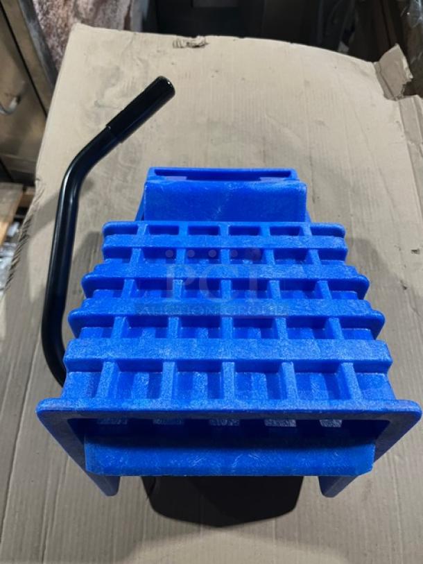 Brand new commercial blue plastic mop side press wringer, Model WH6000B, features durable build and ergonomic handle.