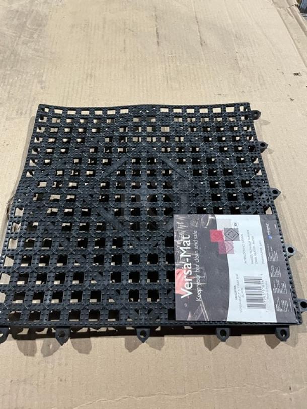 Brand new San Jamar Versa-Mat, model VM5280BK, black 1' x 1' interlocking bar mat, with visible label, excellent condition.