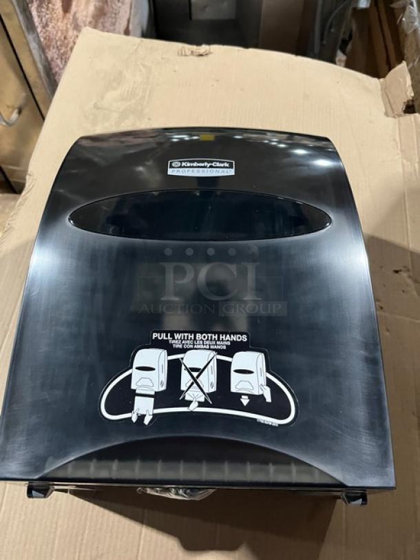 Brand new Kimberly Clark Professional Sanitouch smoke black hard-roll paper towel dispenser, commercial use.