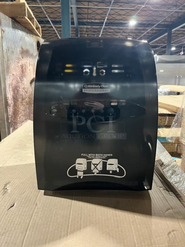 Brand new Kimberly Clark Professional smoke black Sanitouch hard-roll paper towel dispenser.