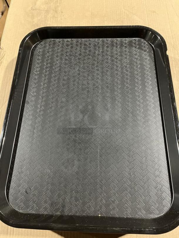 Brand new Carlisle CT141803 black serving tray, 14"x18", with textured surface. Ideal for fast food use.