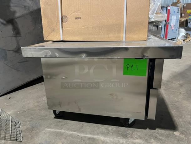 True Commercial Stainless Steel 2 Drawer Refrigerated Chef Base, Model TRCB-52-60, with oversized worktop, on casters.