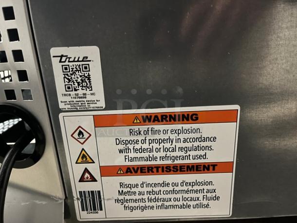 True Commercial Stainless Steel 2 Drawer Refrigerated Chef Base, Model TRCB5260, warning labels, on casters.
